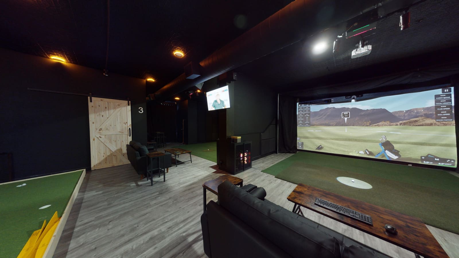 Bay 1 lounge area at Club X Indoor Golf — corporate event setup capacity